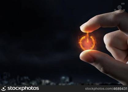 Power symbol between fingers. Close view of male hand taking with fingers power sign