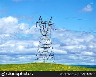 Power Tower On A Hill Against A Blue Sky