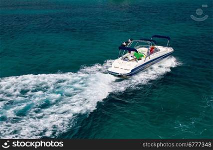 Powerboat on blue open sea water