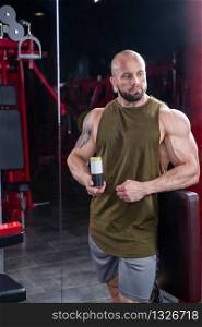 Powerful muscular man represent dietary drink. Concept of healthy lifestyle