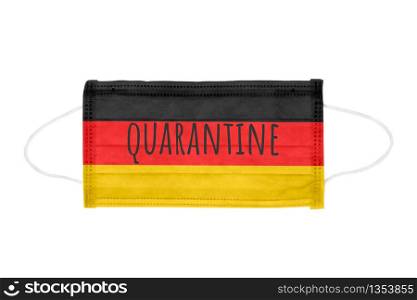 PP non-woven disposable medical face mask isolated on white background. Quarantine lettering on medical mask toned in Germany flag colors. PP non-woven disposable medical face mask isolated on white background
