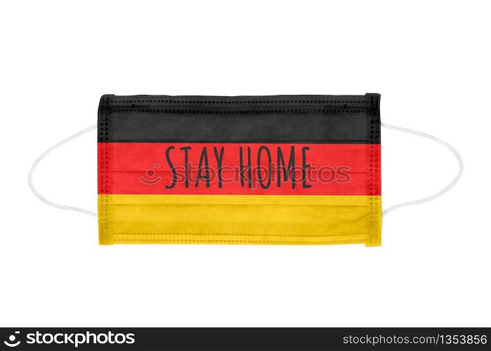 PP non-woven disposable medical face mask isolated on white background. Quarantine lettering on medical mask toned in Germany flag colors. PP non-woven disposable medical face mask isolated on white background