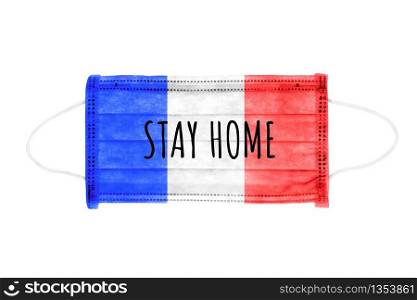 PP non-woven disposable medical face mask isolated on white background. Stay home lettering on medical mask toned in france flag colors.. PP non-woven disposable medical face mask isolated on white background