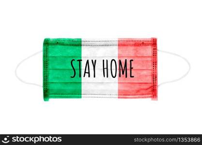 PP non-woven disposable medical face mask isolated on white background. Stay home lettering on medical mask toned in italy flag colors.. PP non-woven disposable medical face mask isolated on white background