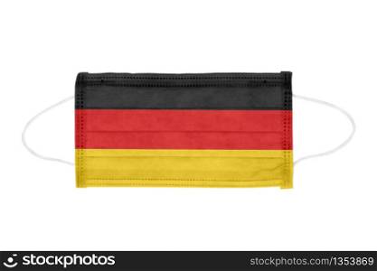 PP non-woven disposable medical face mask isolated on white background. Medical mask toned in Germany flag colors. PP non-woven disposable medical face mask isolated on white background