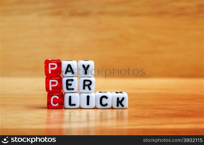 PPC Pay Per Click text on dices on wooden background