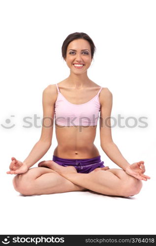 Practicing Yoga. Lotus. Young woman isolated on white background
