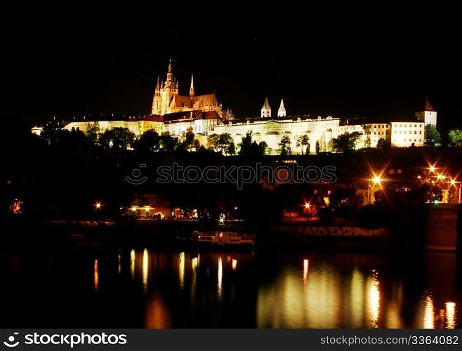 Prague Castle at night, reflection in the river. Prague, Czech Republic