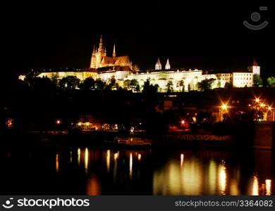 Prague Castle at night, reflection in the river. Prague, Czech Republic