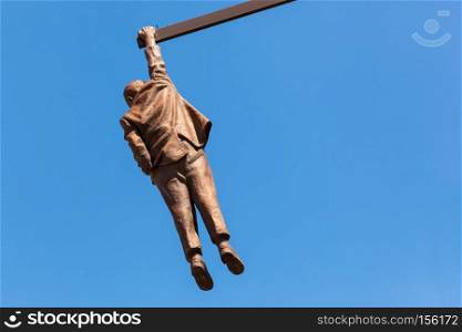 PRAGUE, CZECH REPUBLIC - APRIL 28, 2016 : Statue of Sigmund Freud hanging by one hand by David Cerny. His works can be seen in many locations in Prague. Statue of Sigmund Freud hanging by one hand in Prague, Czech Republic.