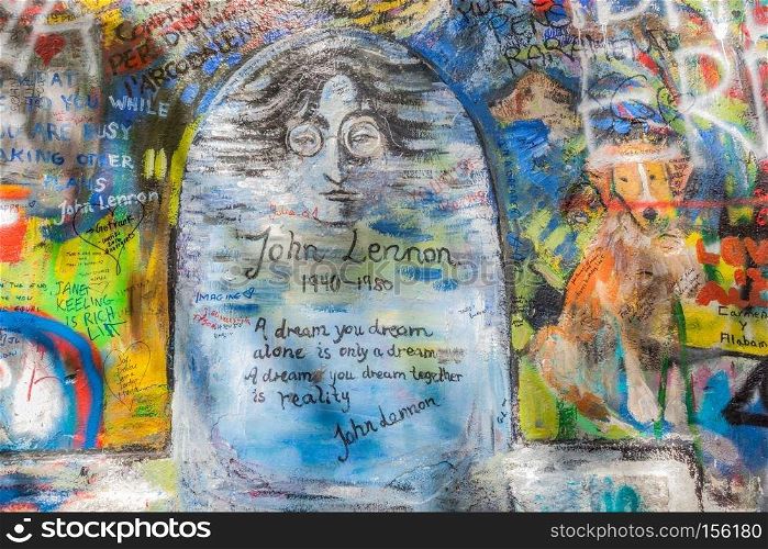 PRAGUE, CZECH REPUBLIC - APRIL 29, 2016: John Lennon Wall has been filled with Lennon inspired graffiti and lyrics from Beatles’ songs since the 1980s as irritation of the communist regime.. John Lennon Wall, Prague, Czech Republic. Graffiti background