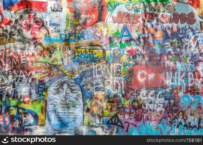 PRAGUE, CZECH REPUBLIC - APRIL 29, 2016: John Lennon Wall has been filled with Lennon inspired graffiti and lyrics from Beatles? songs since the 1980s as irritation of the communist regime.. John Lennon Wall, Prague, Czech Republic. Graffiti background