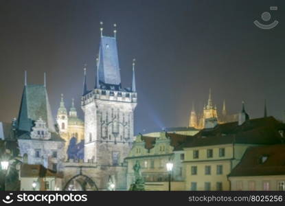 Prague, Czech Republic. Night view of the Old Town tower on Charles Bridge.