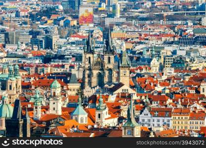Prague, Czech Republic. View of Prague from a height of Petrin hill. The highest point above Prague. Red tiled roofs and towers of the old town.