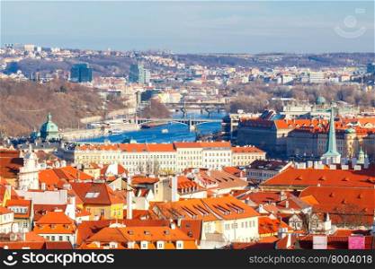Prague, Czech Republic. View of Prague from a height of Petrin hill. The highest point above Prague. Red tiled roofs and towers of the old town.