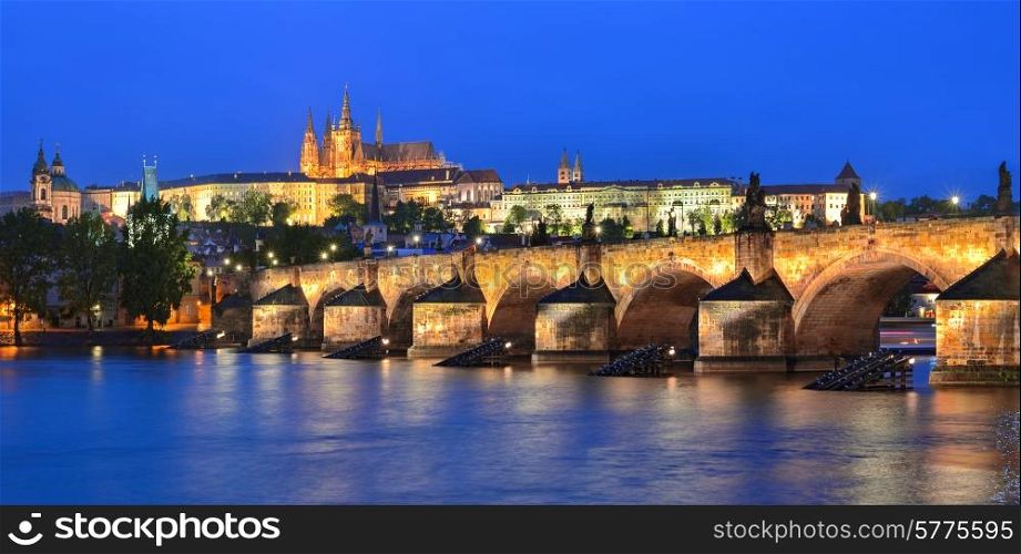 Prague. Panorama of the Vltava river, Charles Bridge and St. Vitus Cathedral at night. Karluv Most, Prazsky hrad. Czech Republic.