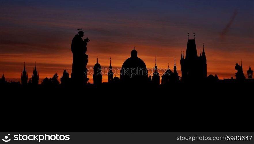 Prague silhouettes from Charles Bridge before dawn, Prague, Czech Republic