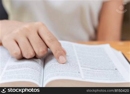 Pray and religion concept, Female christian read holy bible to studying of faith and spirituality.
