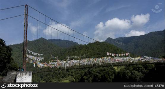 Prayer flags hanging over suspension bridge, Punakha, Punakha Valley, Punakha District, Bhutan