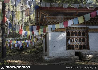 Prayer flags with stupa at the Taktsang Monastery, Paro, Paro District, Paro Valley, Bhutan