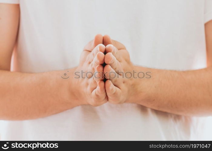 Praying hands with faith in religion and belief in God on dark background. Power of hope or love and devotion. Prayer position