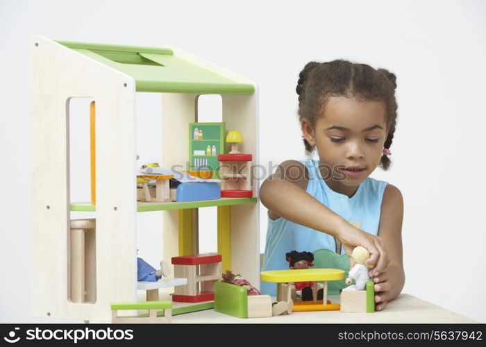 Pre-School Pupil Playing With Wooden House