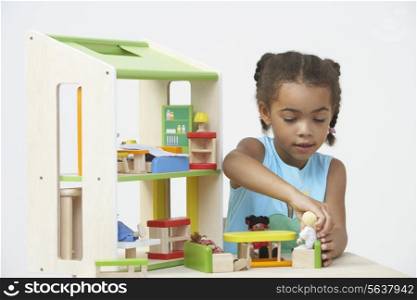 Pre-School Pupil Playing With Wooden House