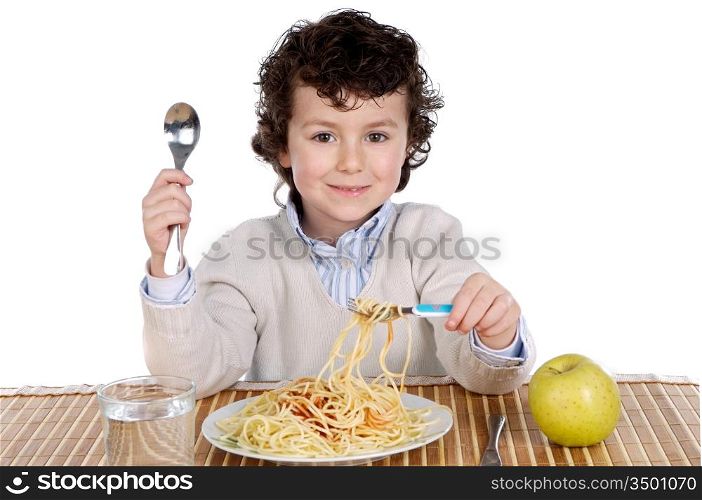 Precious child eating spaghetti on a white background