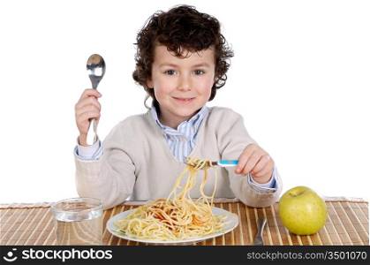 Precious child eating spaghetti on a white background