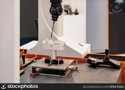 Precision measuring industry machine working in factory, close up