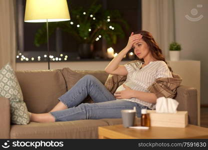 pregnancy and people concept - sick pregnant woman having headache at home. sick pregnant woman having headache at home