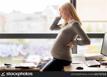 pregnancy, business, stress, gestosis and work concept - pregnant businesswoman feeling sick at office work