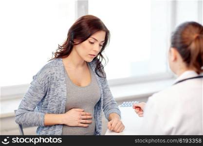 pregnancy, gynecology, medicine, health care and people concept - gynecologist doctor and pregnant woman meeting at hospital