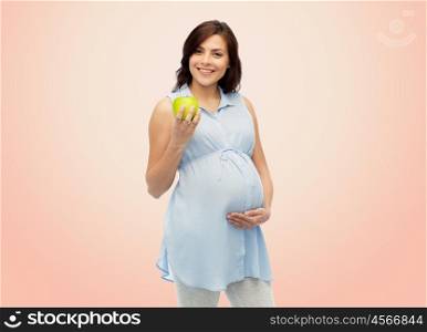 pregnancy, healthy eating, food and people concept - happy pregnant woman holding green apple over beige background
