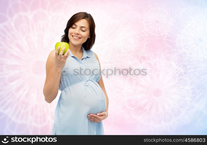 pregnancy, healthy eating, food and people concept - happy pregnant woman holding green apple over rose quartz and serenity pattern background