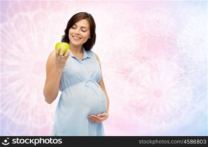 pregnancy, healthy eating, food and people concept - happy pregnant woman holding green apple over rose quartz and serenity pattern background