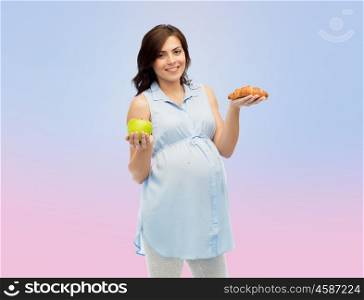pregnancy, healthy eating, junk food and people concept - happy pregnant woman choosing between green apple and croissant over rose quartz and serenity gradient background