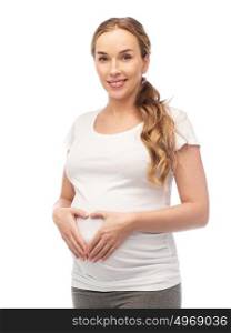 pregnancy, love, people and expectation concept - happy pregnant woman showing heart gesture. happy pregnant woman showing heart gesture