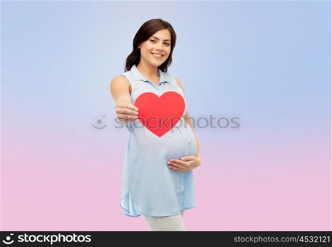 pregnancy, love, people and expectation concept - happy pregnant woman with red heart shape touching her belly over rose quartz and serenity gradient background