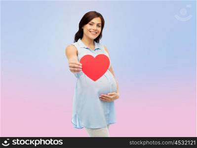 pregnancy, love, people and expectation concept - happy pregnant woman with red heart shape touching her belly over rose quartz and serenity gradient background