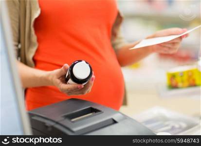pregnancy, medicine, pharmaceutics, health care and people concept - close up of pregnant woman with prescription buying medication at pharmacy cash register