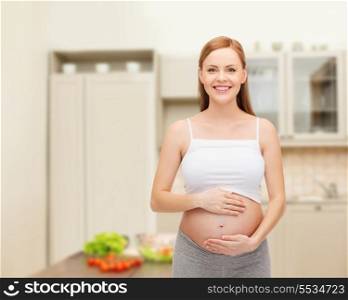 pregnancy, motherhood and happiness concept - happy future mother touching her belly