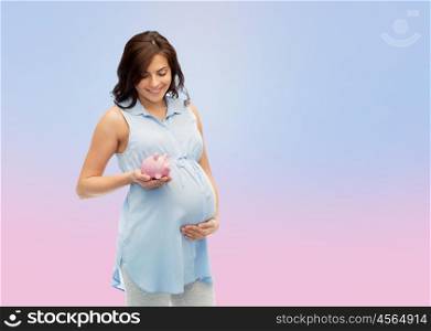 pregnancy, motherhood, finance, saving and people concept - happy pregnant woman with piggybank over rose quartz and serenity gradient background. happy pregnant woman with piggybank