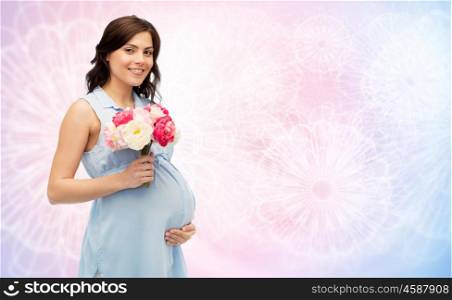 pregnancy, motherhood, holidays, people and expectation concept - happy pregnant woman with flowers touching her big belly over rose quartz and serenity pattern background