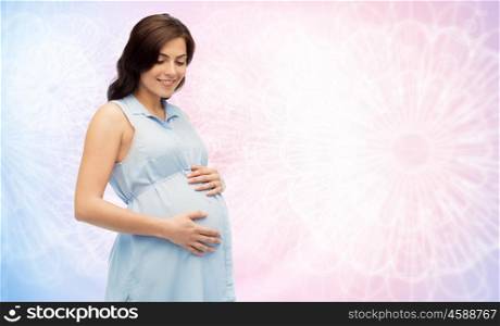 pregnancy, motherhood, people and expectation concept - happy pregnant woman touching her big belly over rose quartz and serenity pattern background
