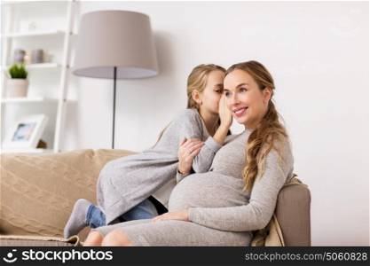 pregnancy, people and family concept - happy girl talking to pregnant woman and whispering secret to her ear at home. happy pregnant woman and girl gossiping at home
