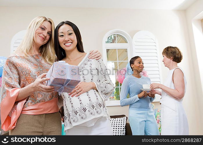 Pregnant Asian Woman with friend at a Baby Shower