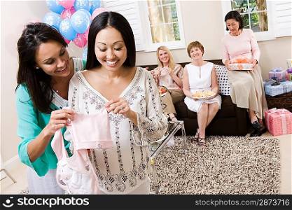Pregnant Asian Woman with friend at a Baby Shower