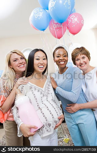 Pregnant Asian Woman with friends at a Baby Shower