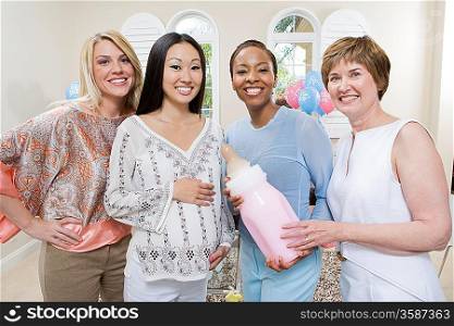 Pregnant Asian Woman with friends at a Baby Shower